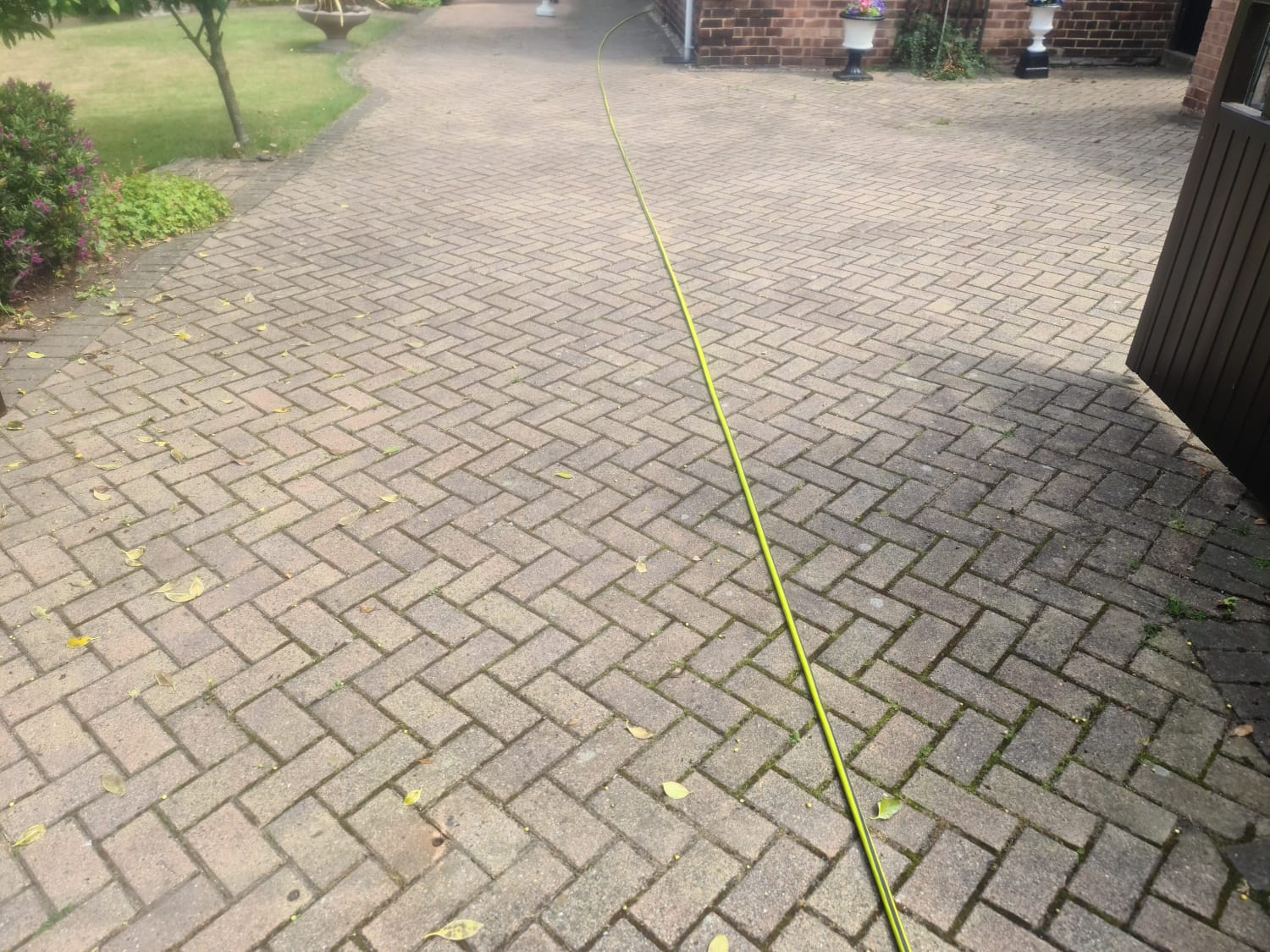 Weathered block paved driveway before cleaning in the Wirral