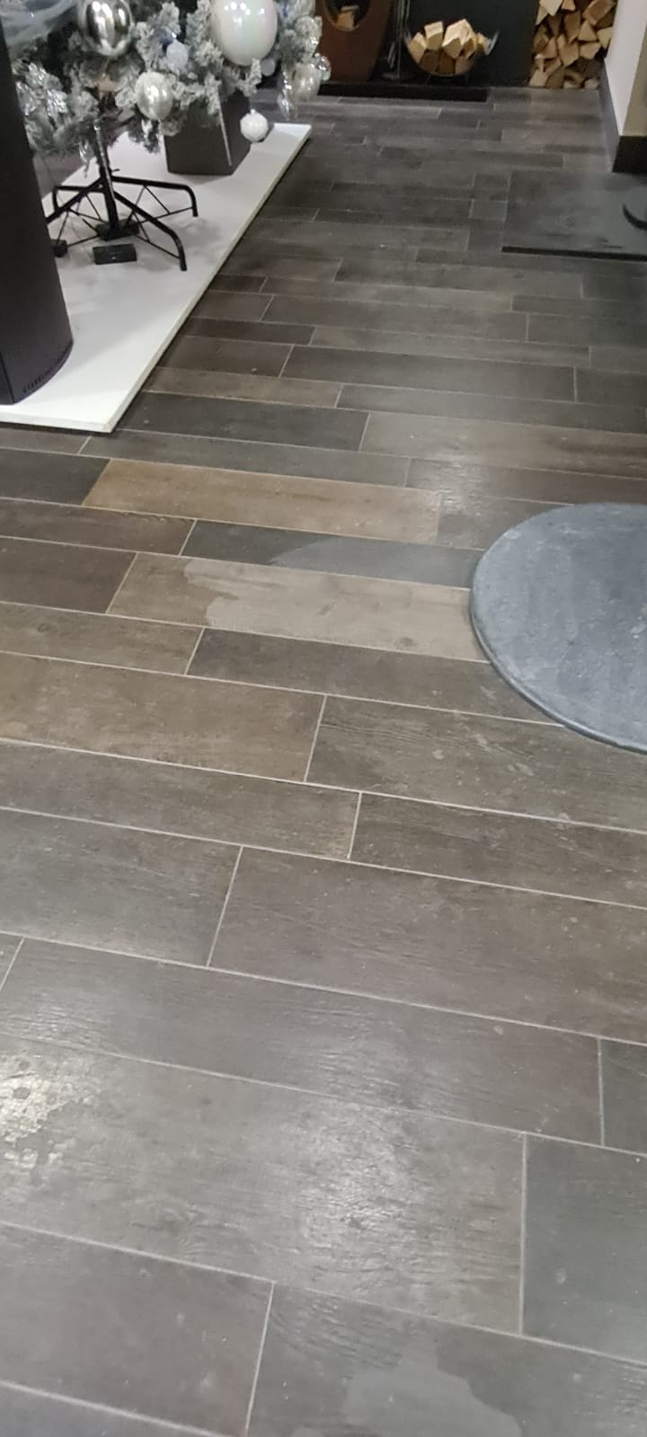 Dull wood effect tiled floor before hard floor cleaning in the Wirral