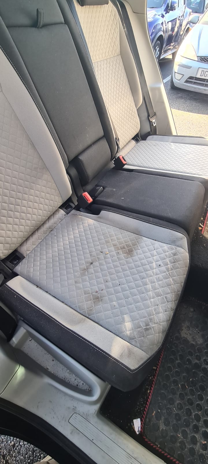 Soiled car rear seats before an interior valet in the Wirral
