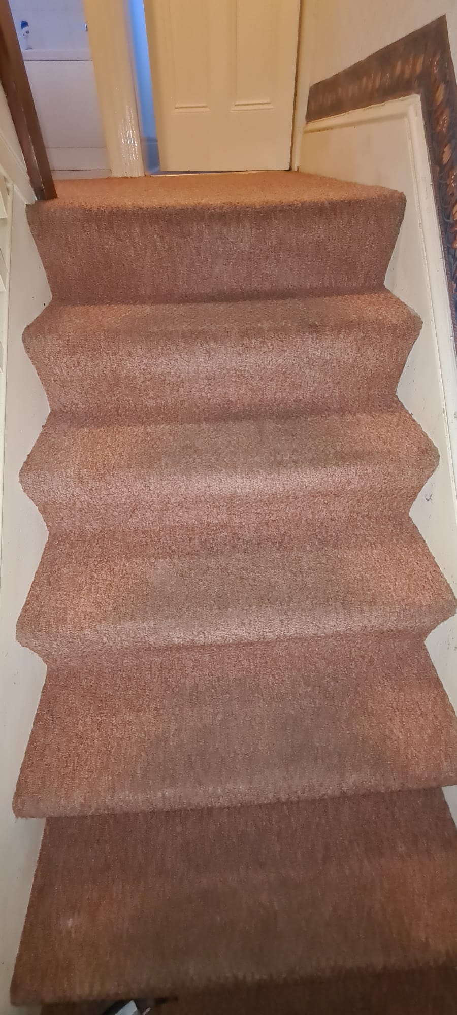 Stained carpet with heavy traffic lanes before cleaning in the Wirral
