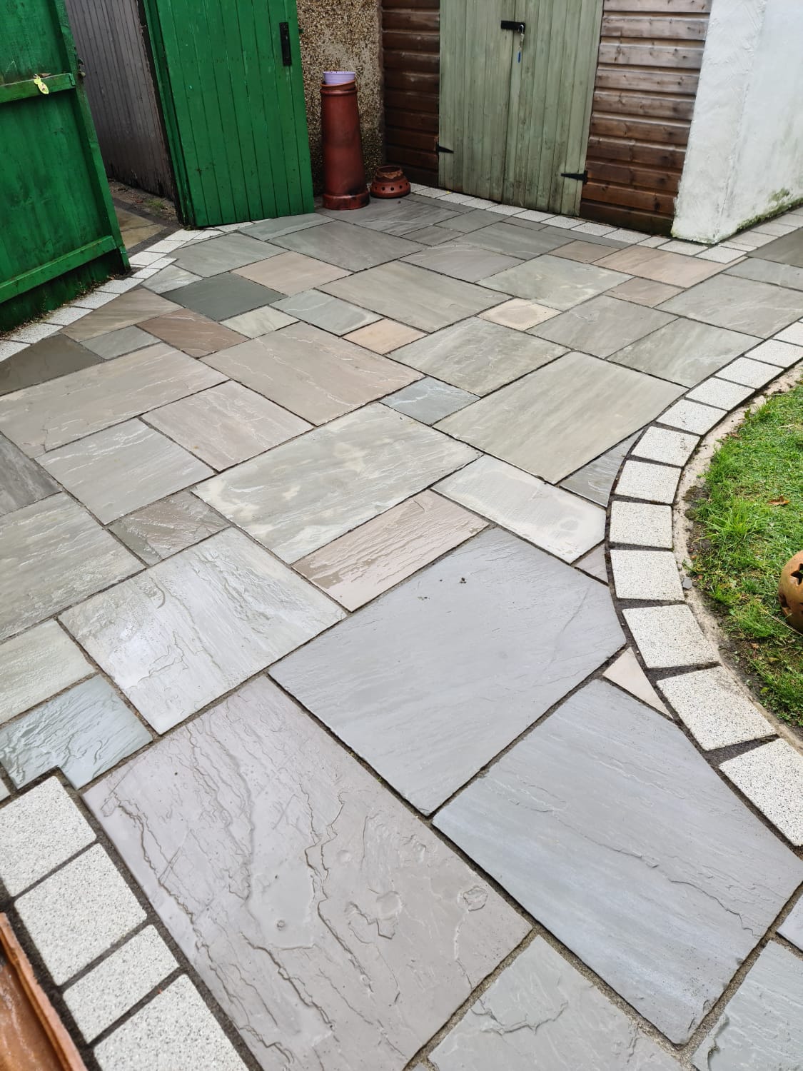 Curved brick paved terrace cleaned by pressure washing in the Wirral