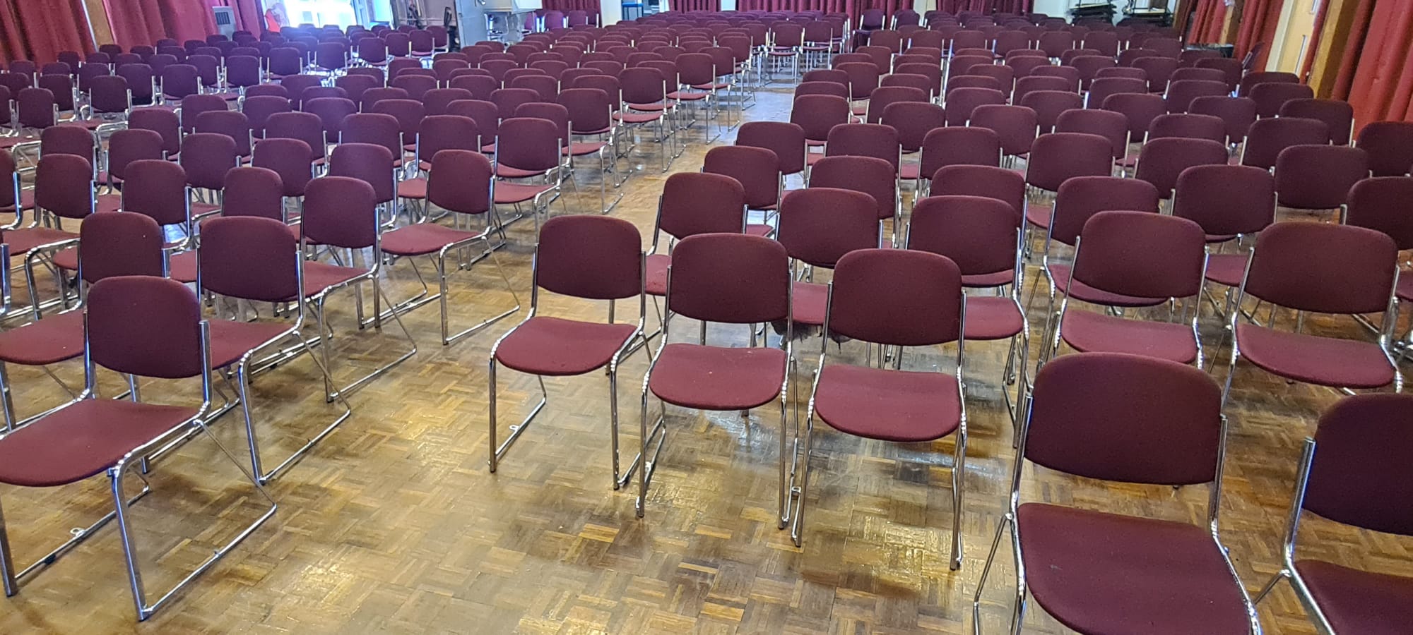 Commercial cleaning in the Wirral, hall floor and stacking chairs cleaned for a community venue