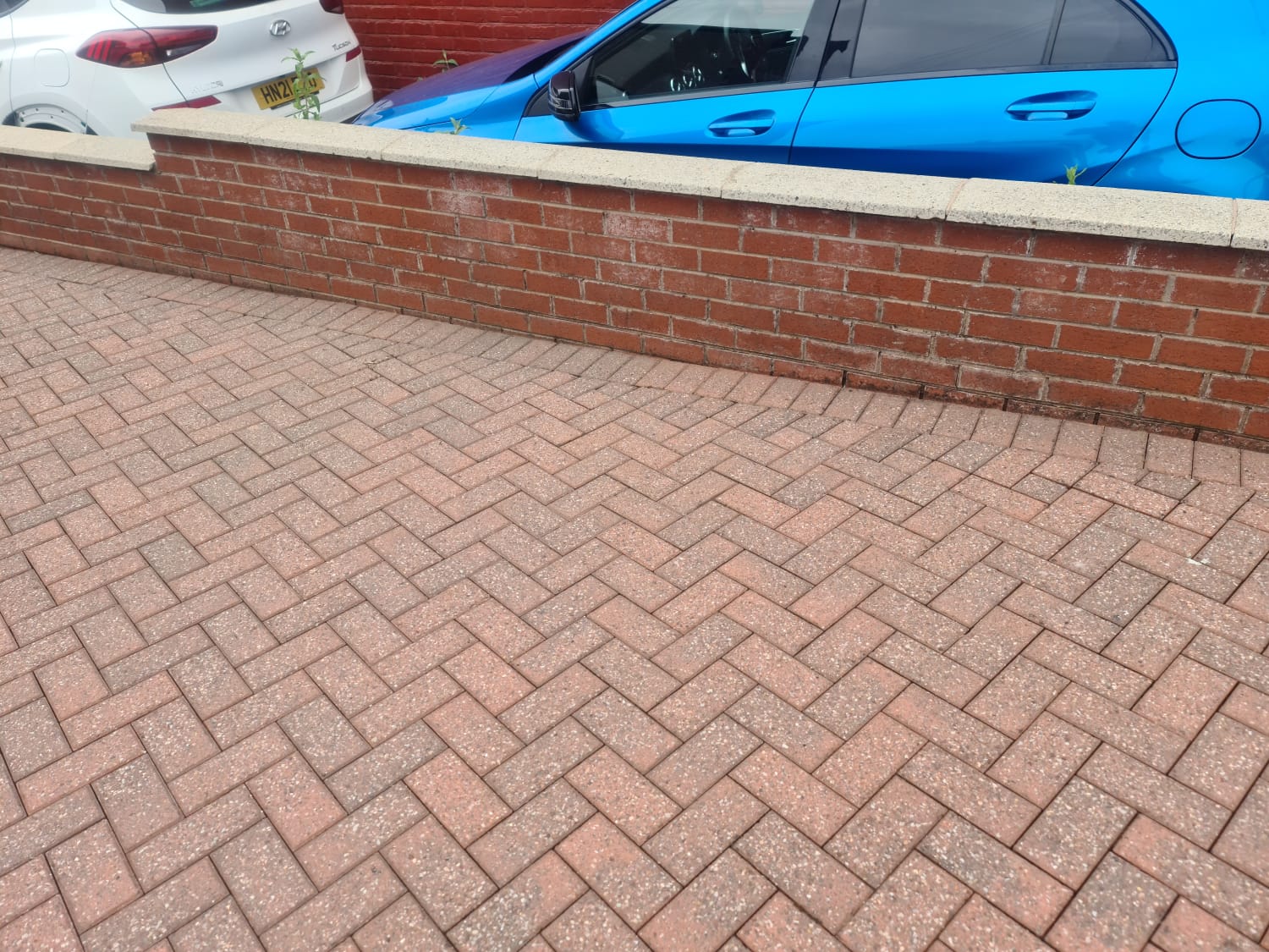Brick paved patio with furniture cleaned by jet washing in the Wirral