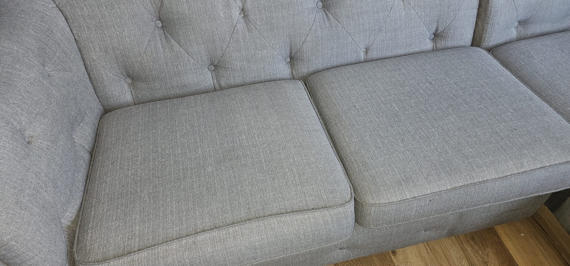 Grey sofa cushions cleaned during a Wirral upholstery clean