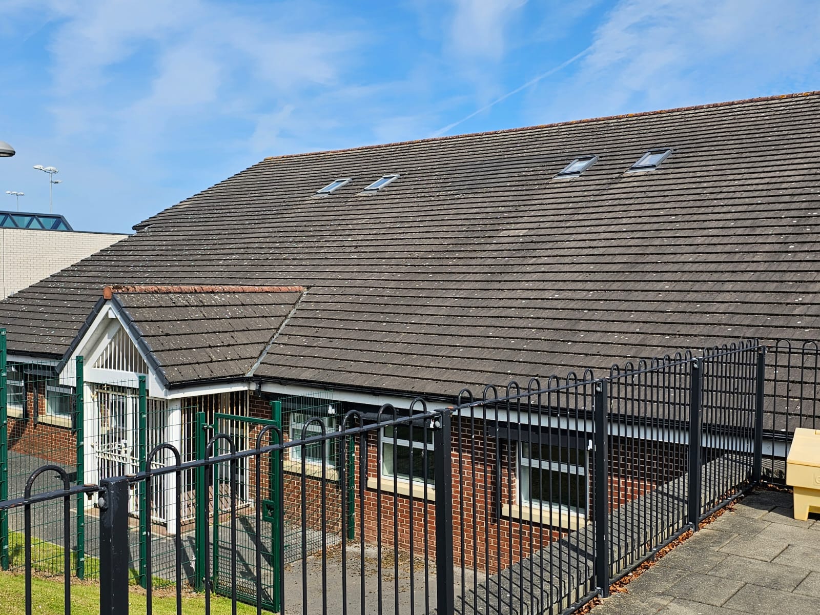 Roof cleaning equipment and ladder at a Wirral property