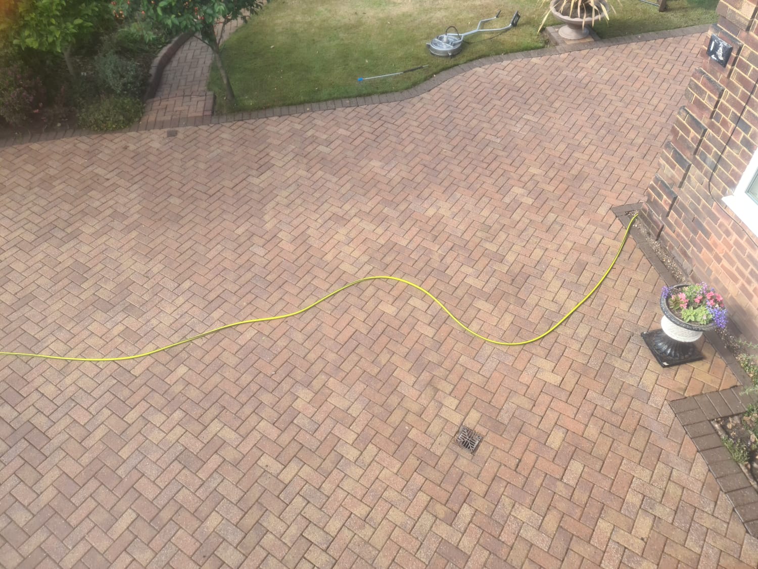 Large block paved courtyard cleaned by pressure washing in the Wirral