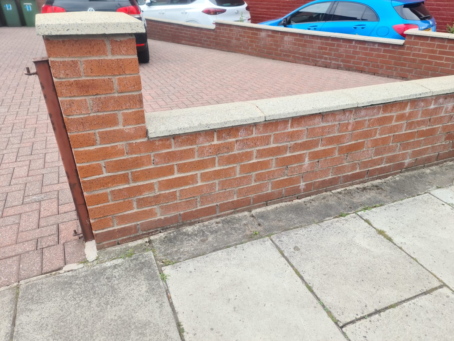 Paving and brick wall cleaned by pressure washing in the Wirral