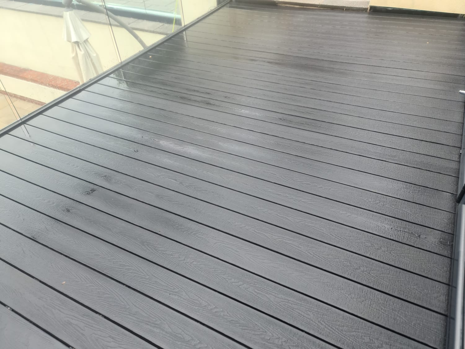 Composite decking cleaned by pressure washing in the Wirral