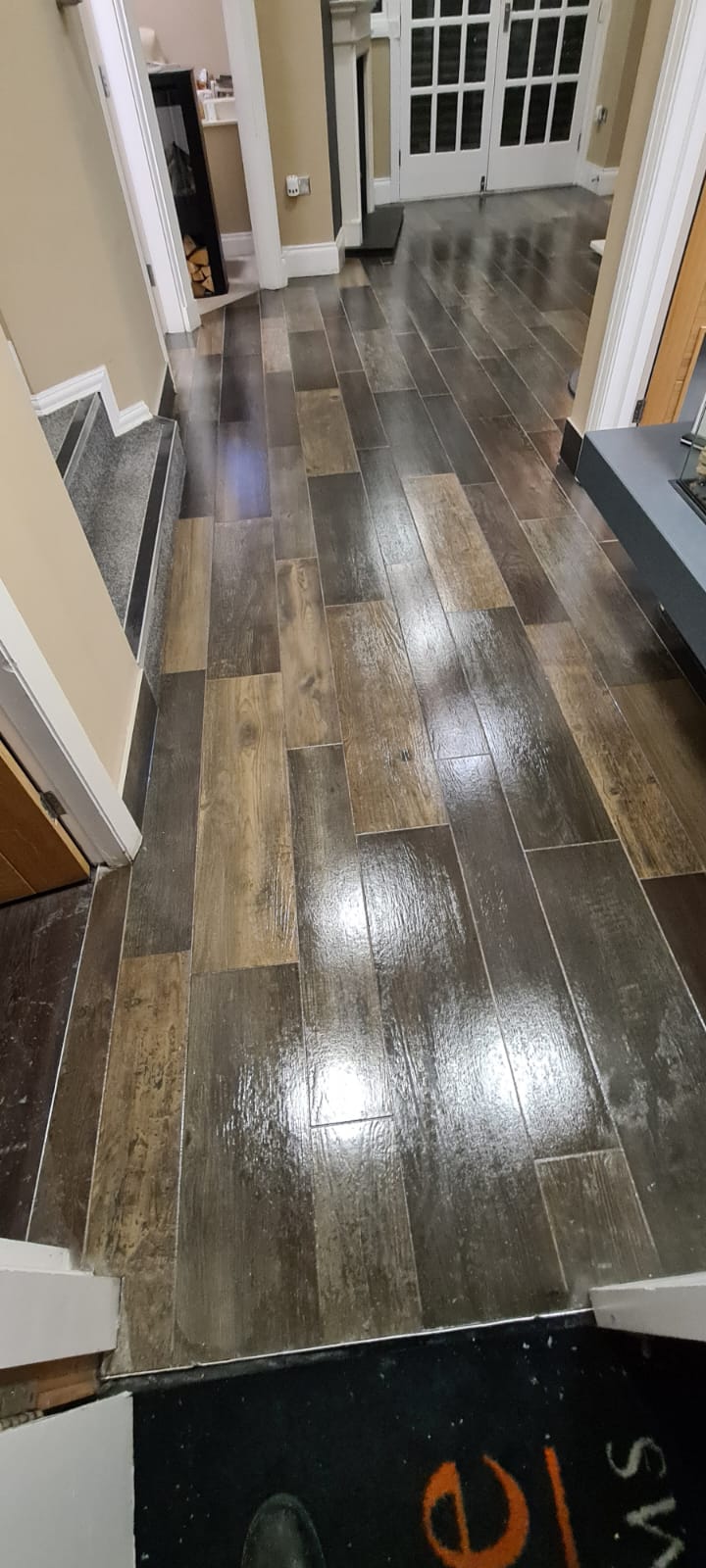 Hard floor cleaning in the Wirral, wood-effect tiled hallway polished