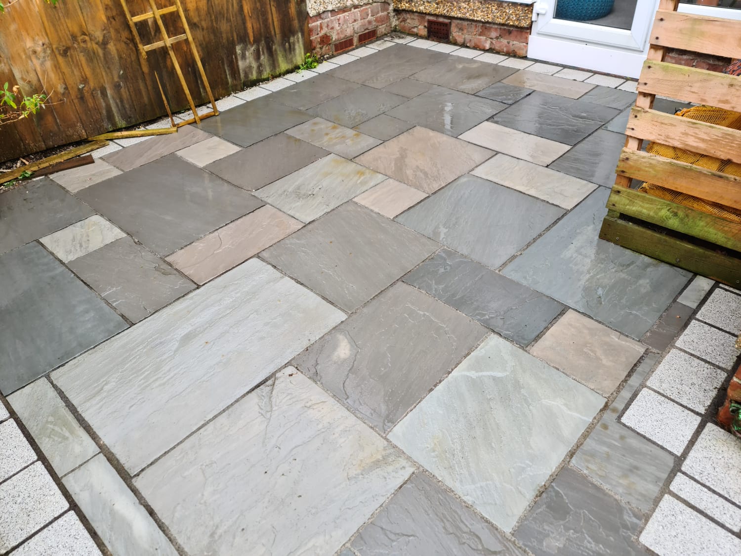 Indian sandstone patio jet washed clean at a Wirral home