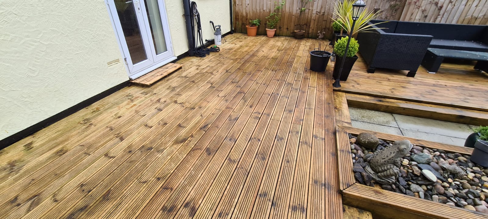 Multi-coloured stone patio jet washed at a Wirral home