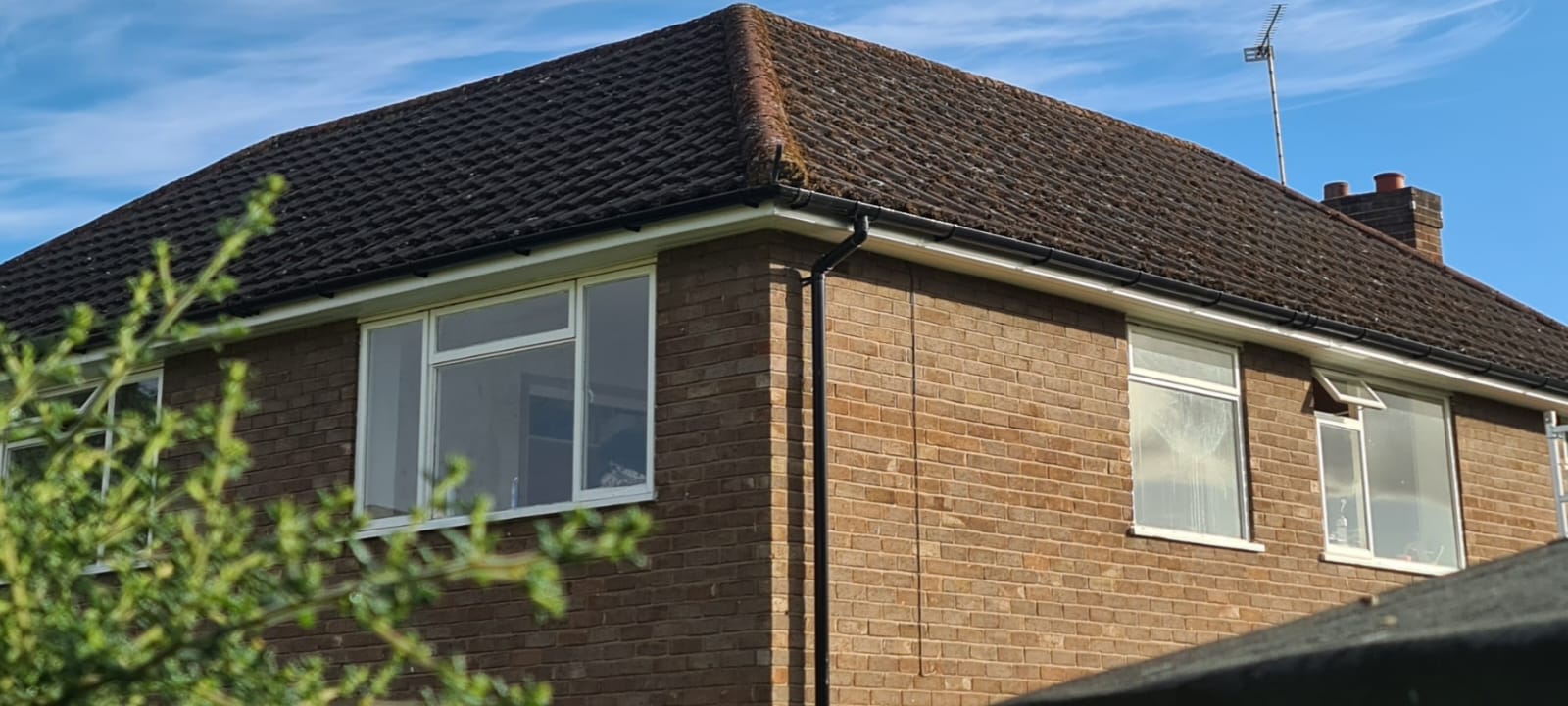 Tiled roof and gutter cleared of moss in the Wirral