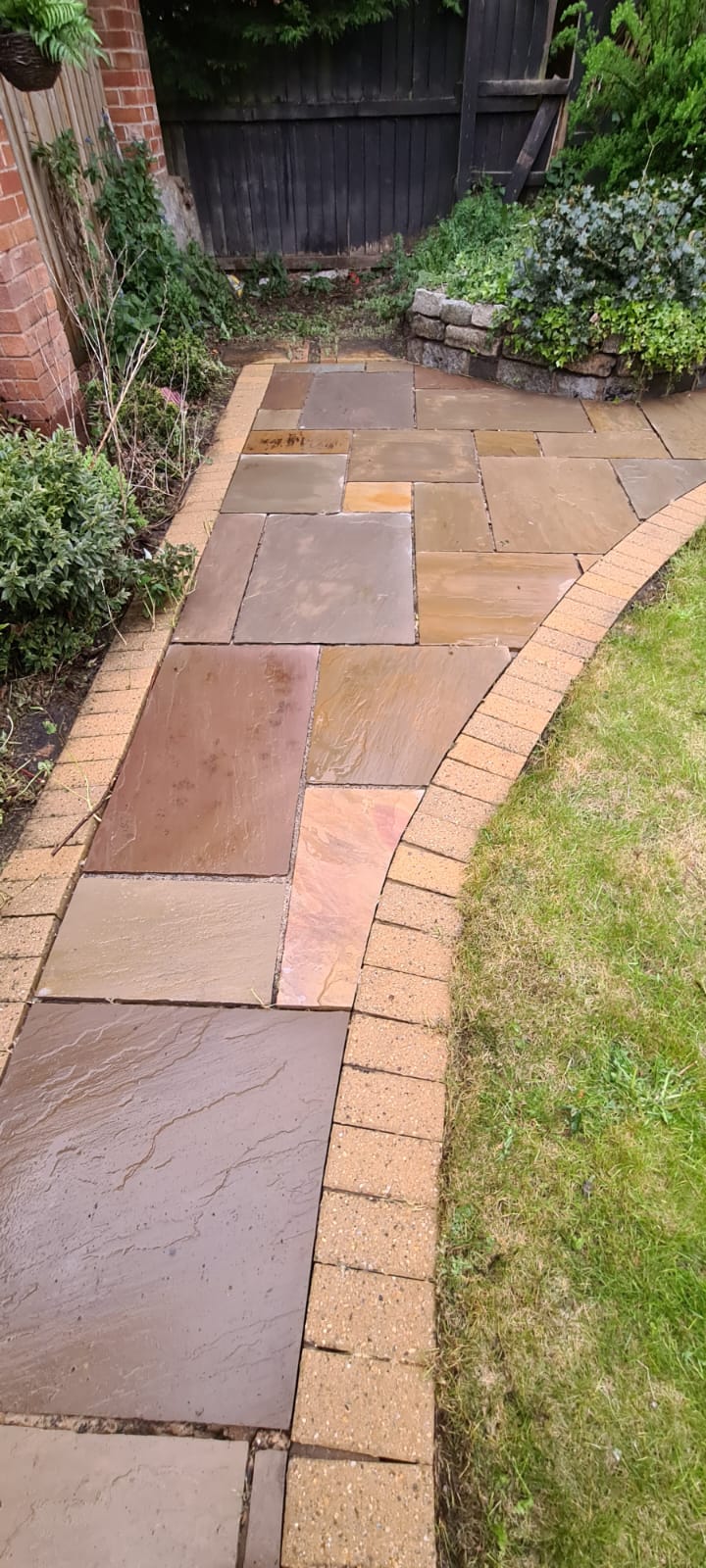 Stone garden path cleaned by pressure washing in the Wirral