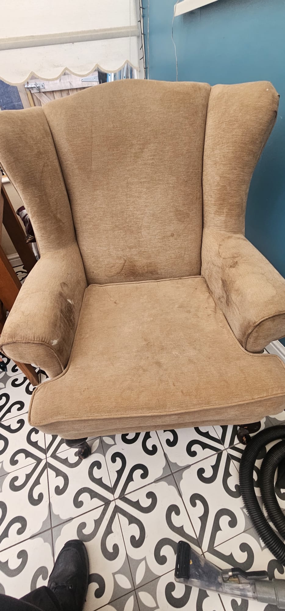 Wingback armchair before upholstery cleaning at a Wirral home